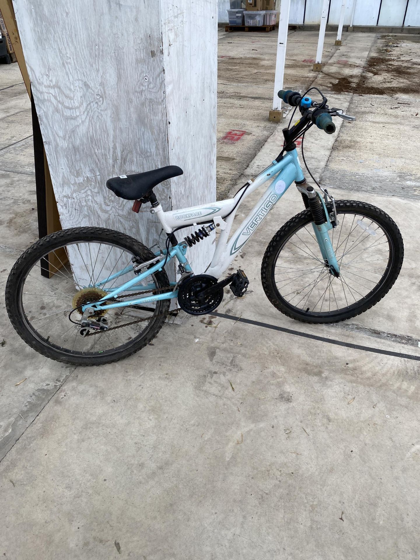 A VERTIGO ROCKFACE MOUNTAIN BIKE WITH FRONT AND REAR SUSPENSION AND 18 SPEED SHIMANO GEAR SYSTEM