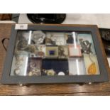 A GLASS TOPPED JEWELLERY DISPLAY BOX WITH CONTENTS