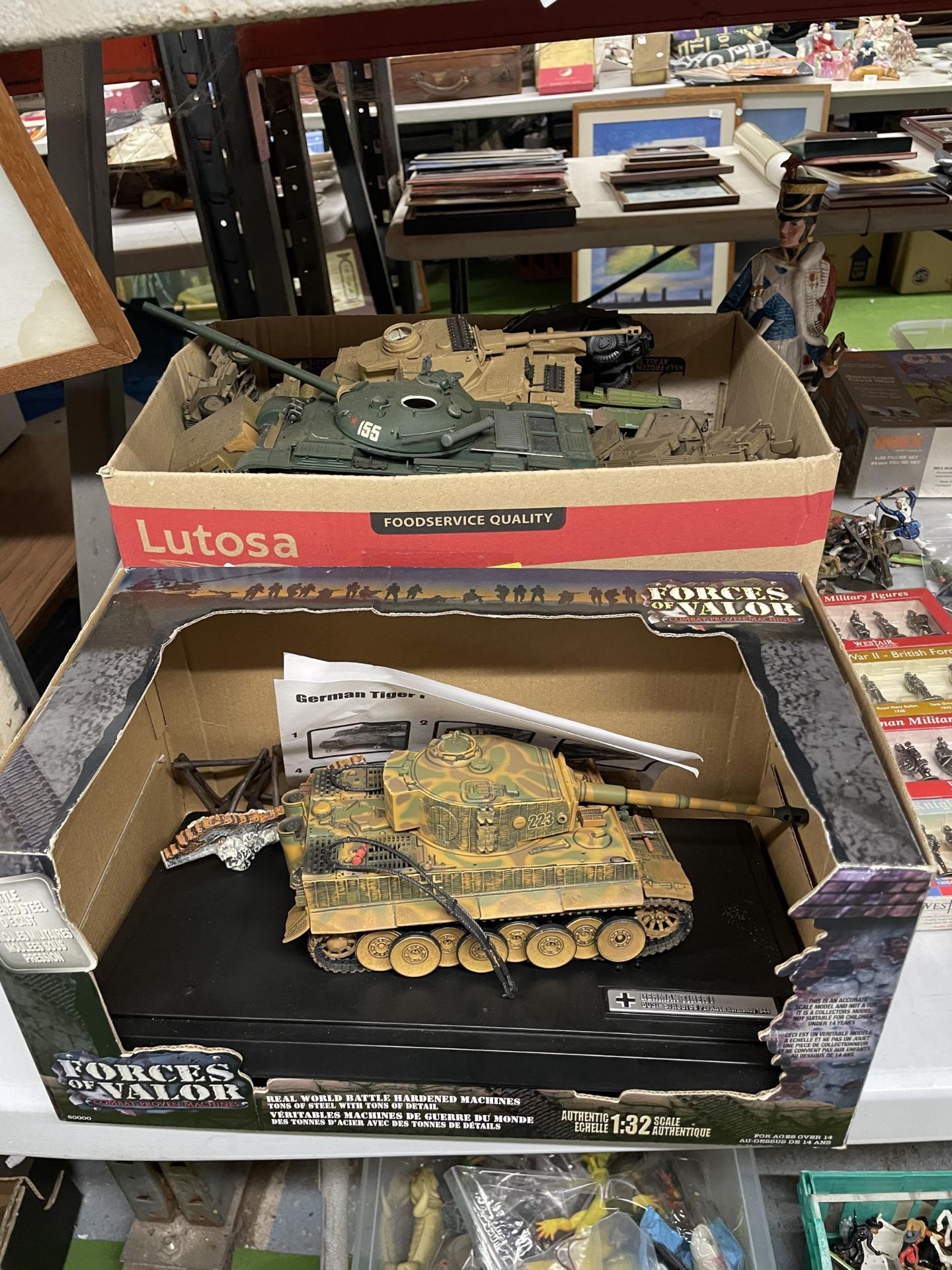 A LARGE QUANTITY OF TOY MILITARY TANKS PLUS A BOXED 'FORCES OF VALOR' GERMAN TIGER 1 TANK