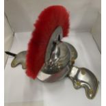 A ROMAN STYLE GLADIATOR HELMET WITH RED PLUME