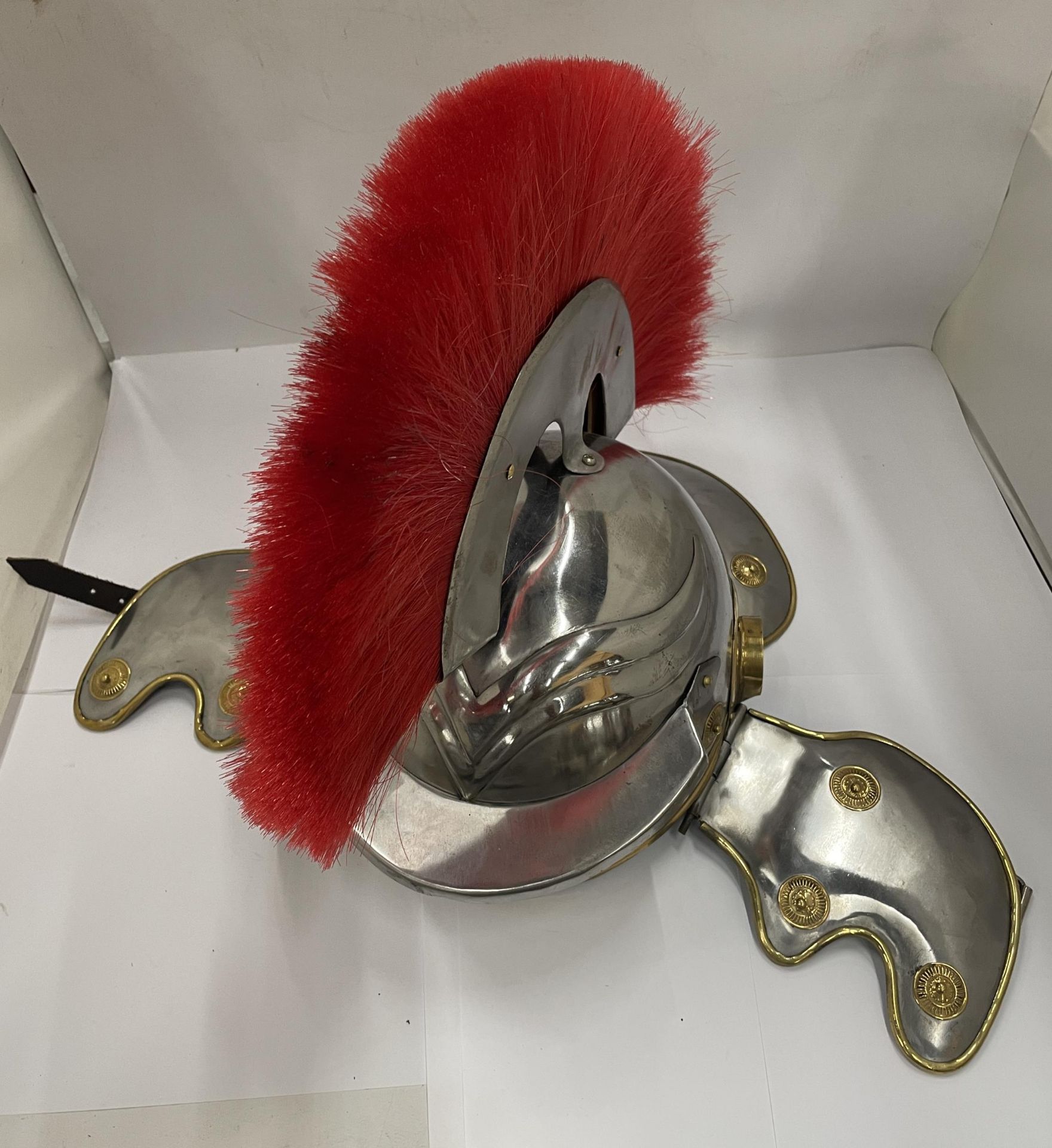 A ROMAN STYLE GLADIATOR HELMET WITH RED PLUME