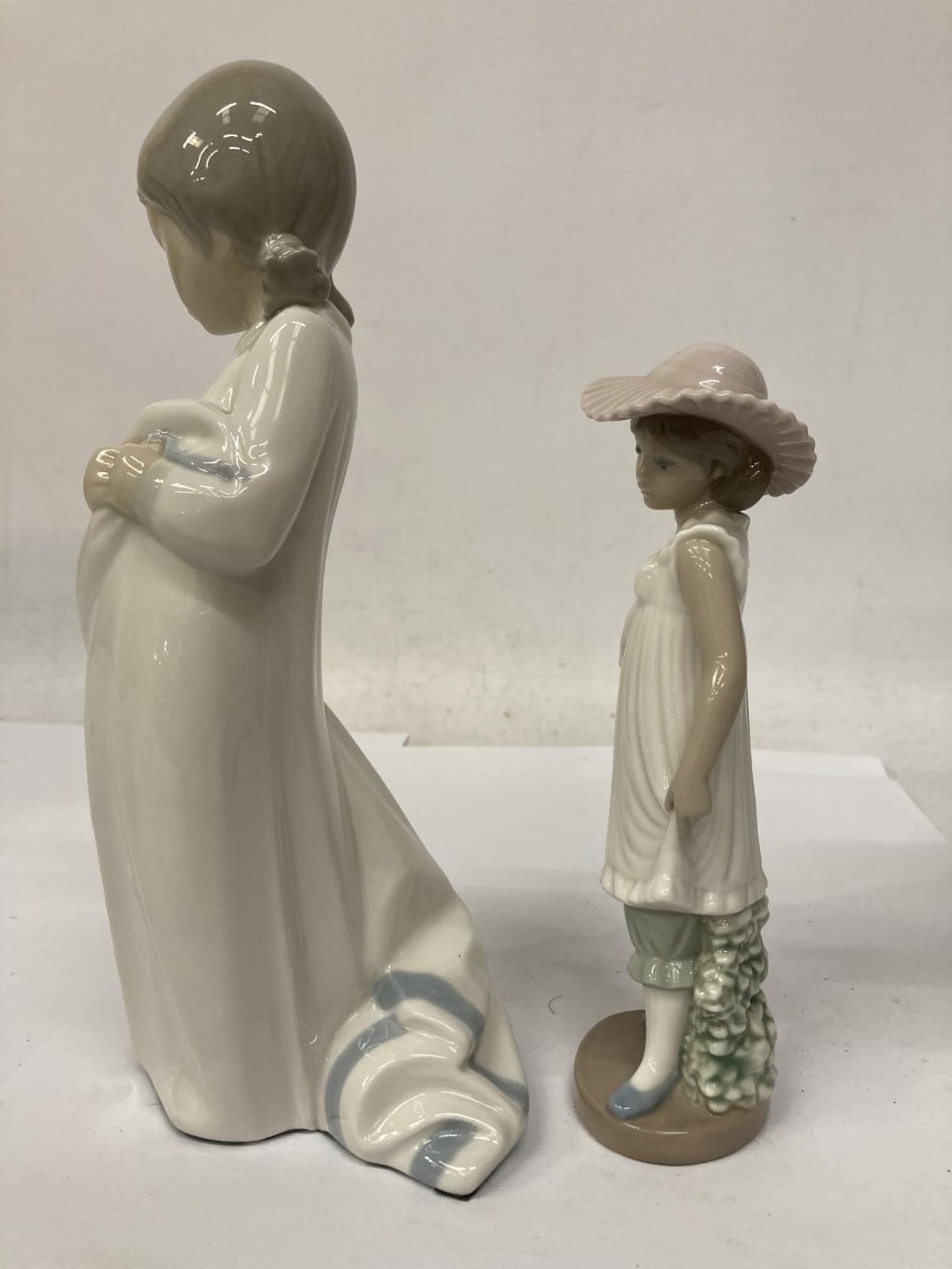 TWO NAO FIGURINES ONE HOLDING A BLANKET AND THE OTHER AN UMBRELLA - Image 4 of 7