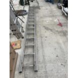 A TWENTY EIGHT RUNG TWO SECTION ALUMINIUM EXTENDING LADDER