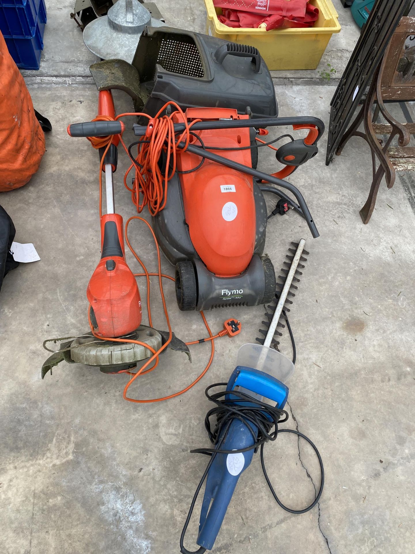 AN ASSORTMENT OF GARDEN POWER TOOLS TO INCLUDE AN ELECTRIC FLYMO MOWER AND STRIMMER ETC