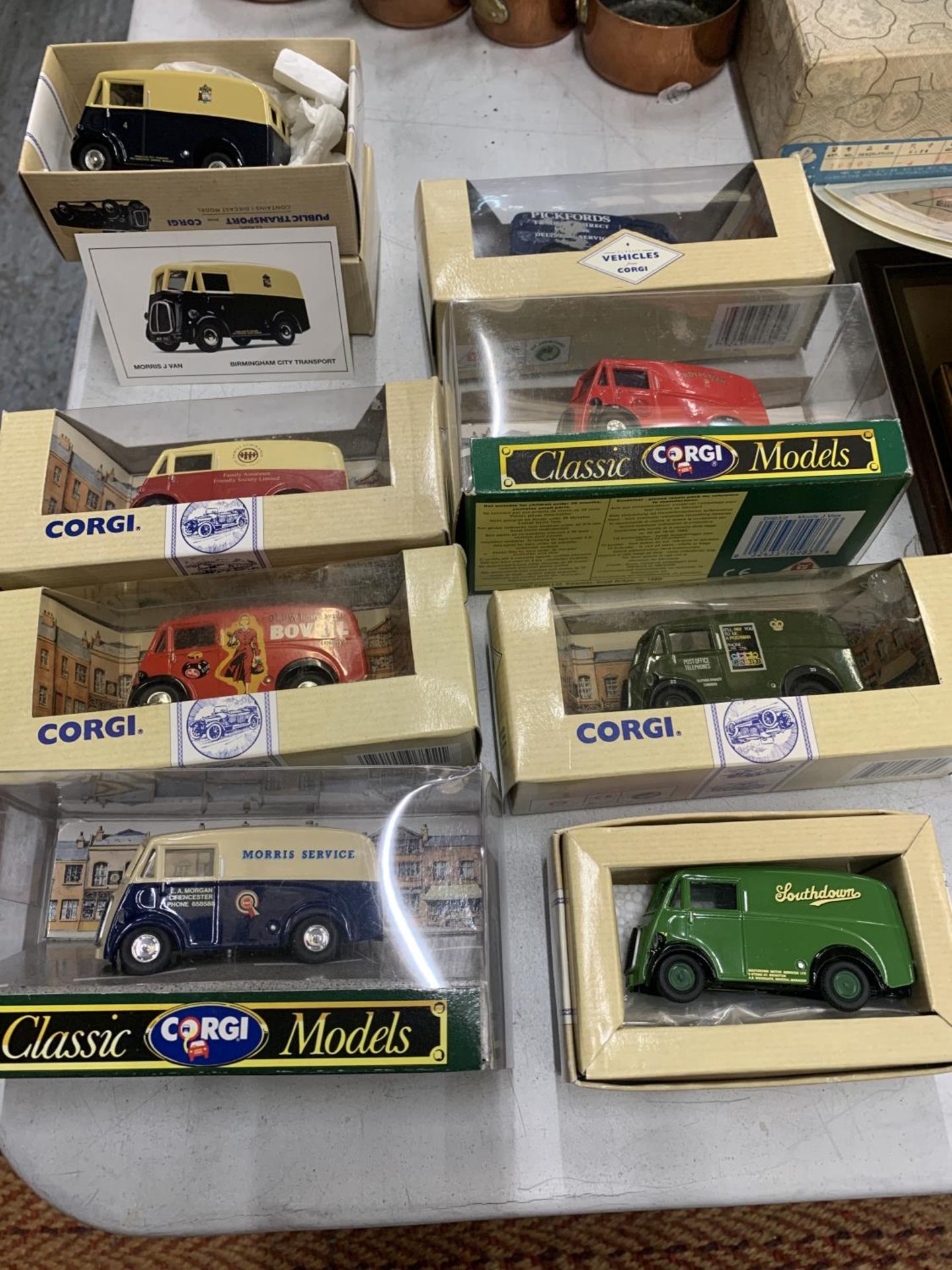 EIGHT BOXED CORGI MODELS OF MORRIS J VANS