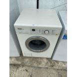 A WHITE MIELE PARAGON WASHING MACHINE