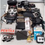 A LARGE COLLECTION OF CAMERAS TO INCLUDE OLYMPUS, PRAKTICA, CANON ETC