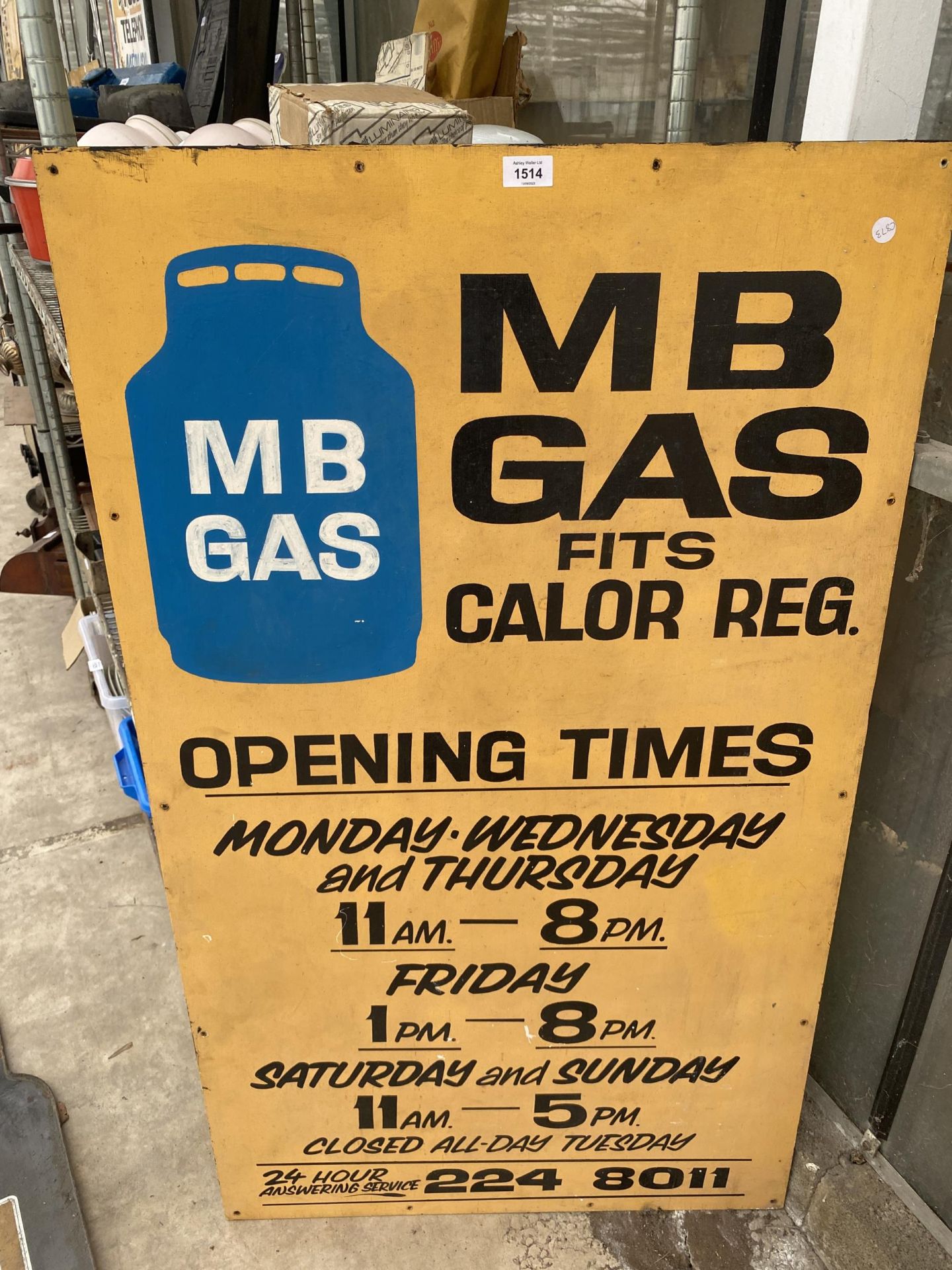 A WOODEN 'MB GAS' SIGN