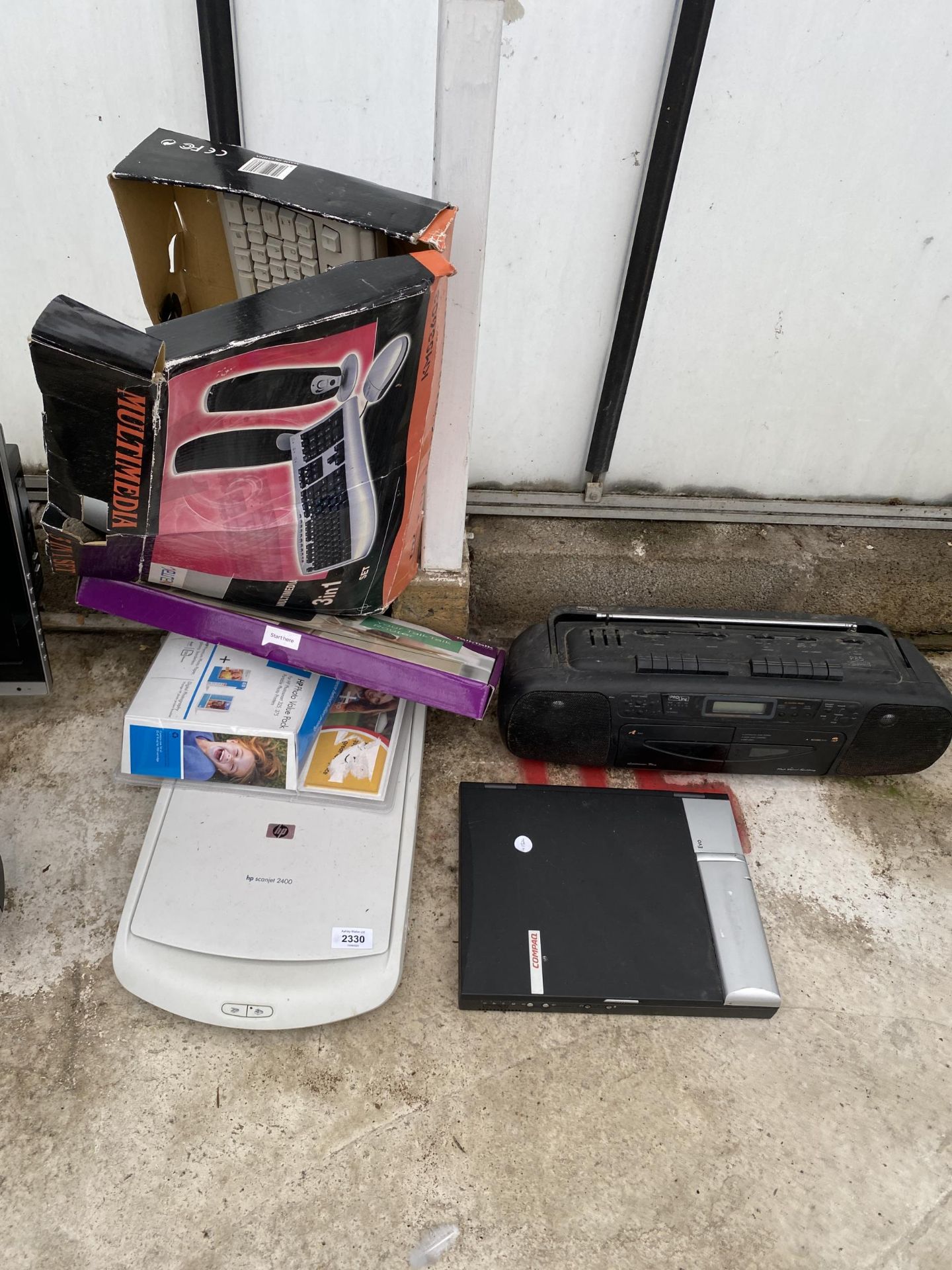 AN ASSORTMENT OF ITEMS TO INCLUDE SCANNERS, KEYBOARDS AND A RADIO