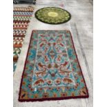 TWO PATTERNED RUGS