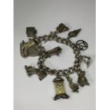 A SILVER CHARM BRACELET WITH THIRTEEN VARIOUS CHARMS