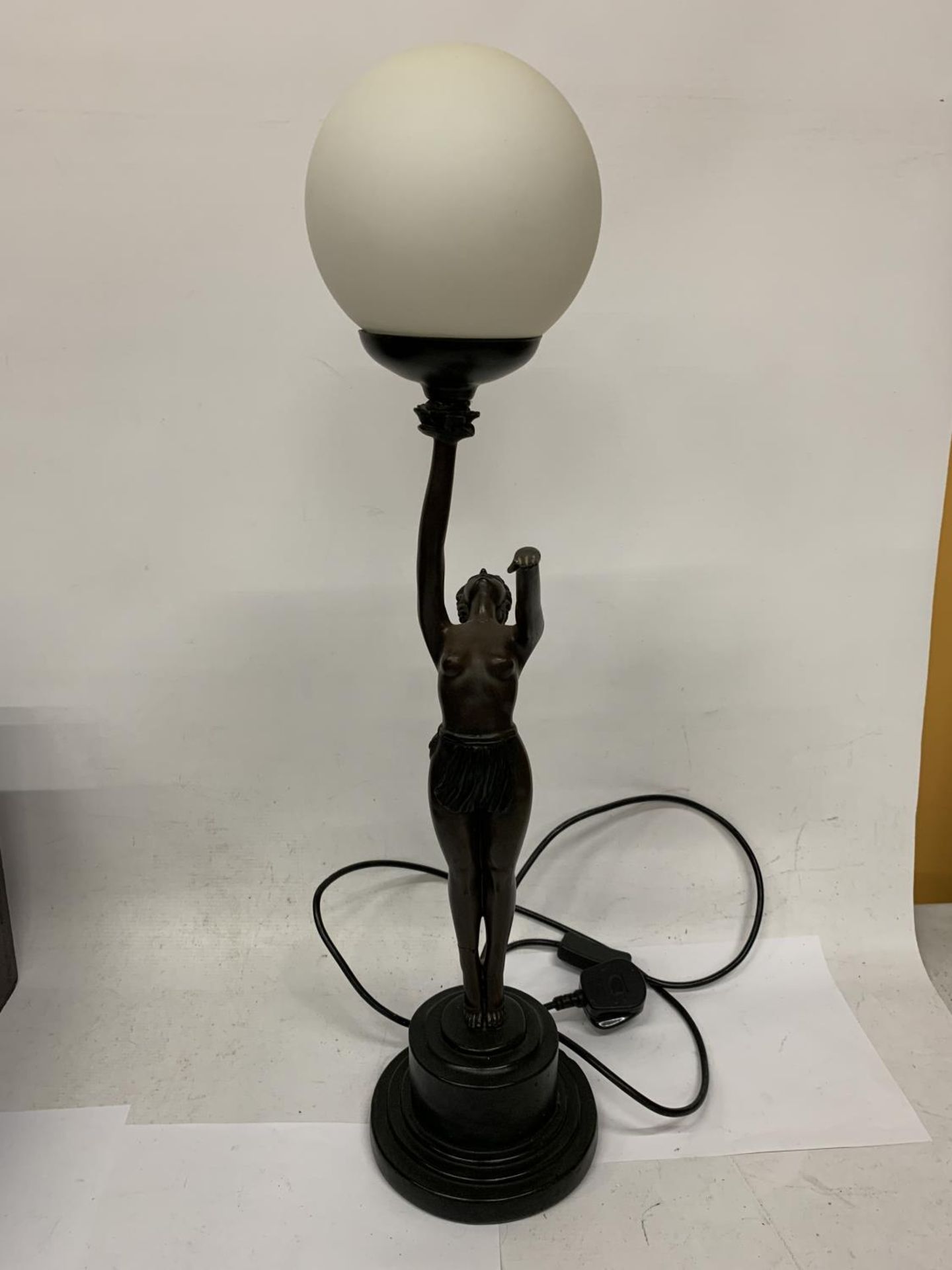 AN ART DECO BRONZE ART LAMP WITH SHADE - "NORA STANDING"