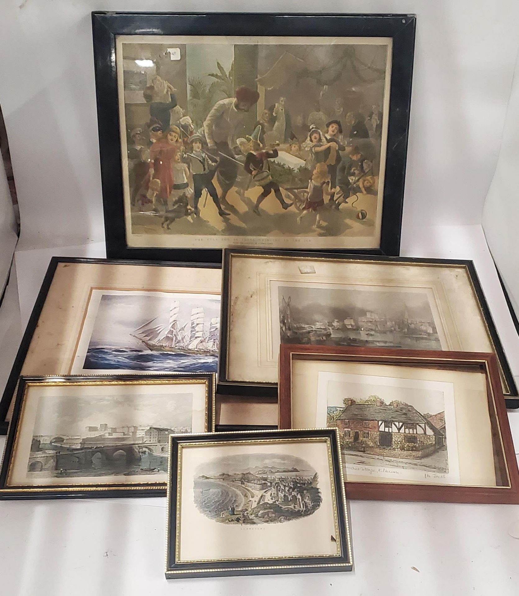 SIX VINTAGE FRAMED PRINTS TO INCLUDE 'THE YULE LOG IN INDIA-BRINGING IN THE ICE', SHIPS,