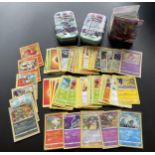 TWO TINS OF ASSORTED POKEMON CARDS, HOLOS, SMALL FOLDER OF CARDS ERC