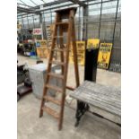 A VINTAGE EIGHT RUNG WOODEN STEP LADDER DATED 1960 AND BELIEVED TO BE FROM NORWEB