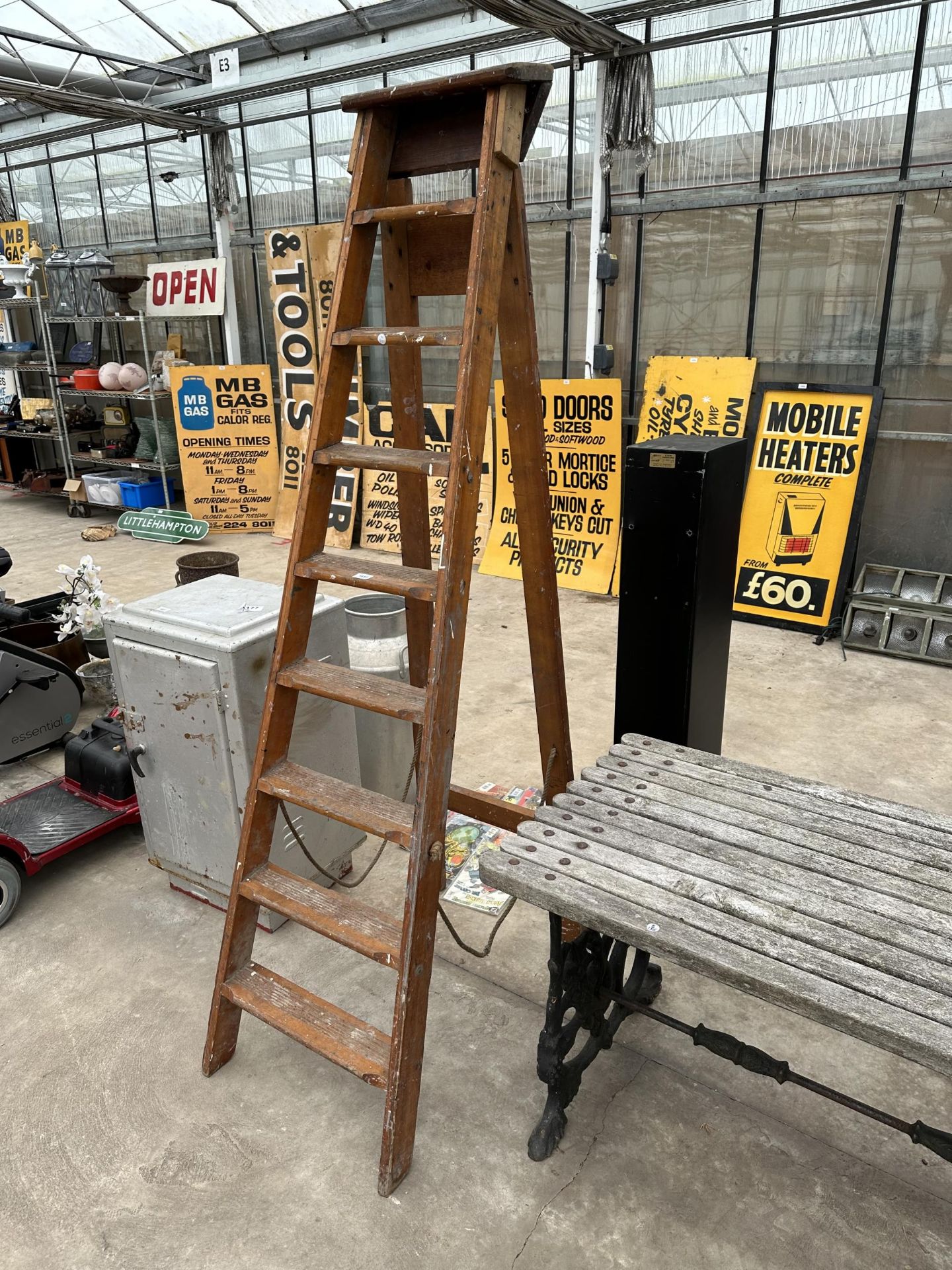 A VINTAGE EIGHT RUNG WOODEN STEP LADDER DATED 1960 AND BELIEVED TO BE FROM NORWEB