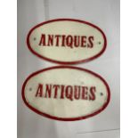 A PAIR OF CAST ANTIQUES OVAL SIGNS