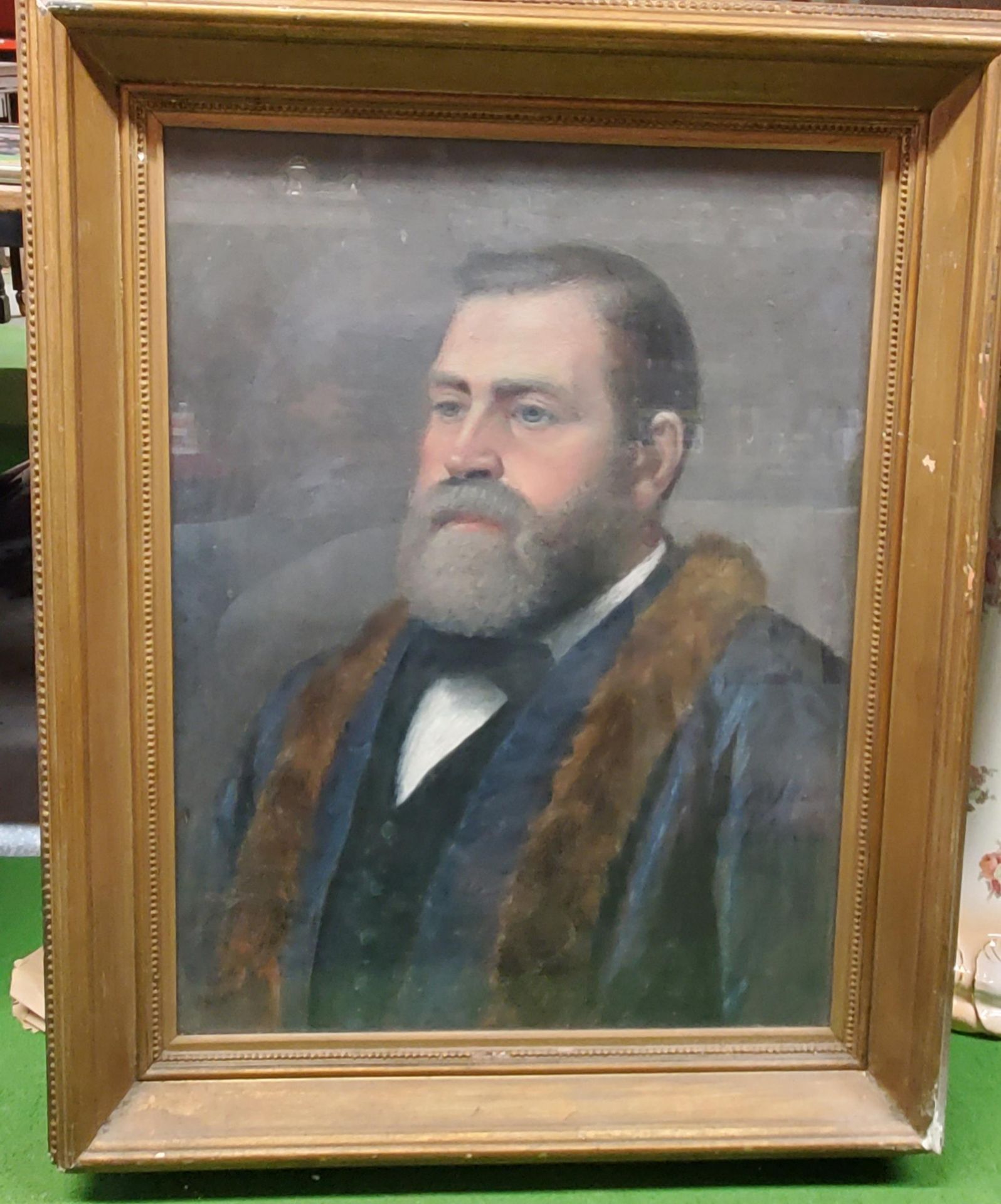 A GILT FRAMED OIL ON CANVAS OF A WELL DRESSED GENTLEMAN