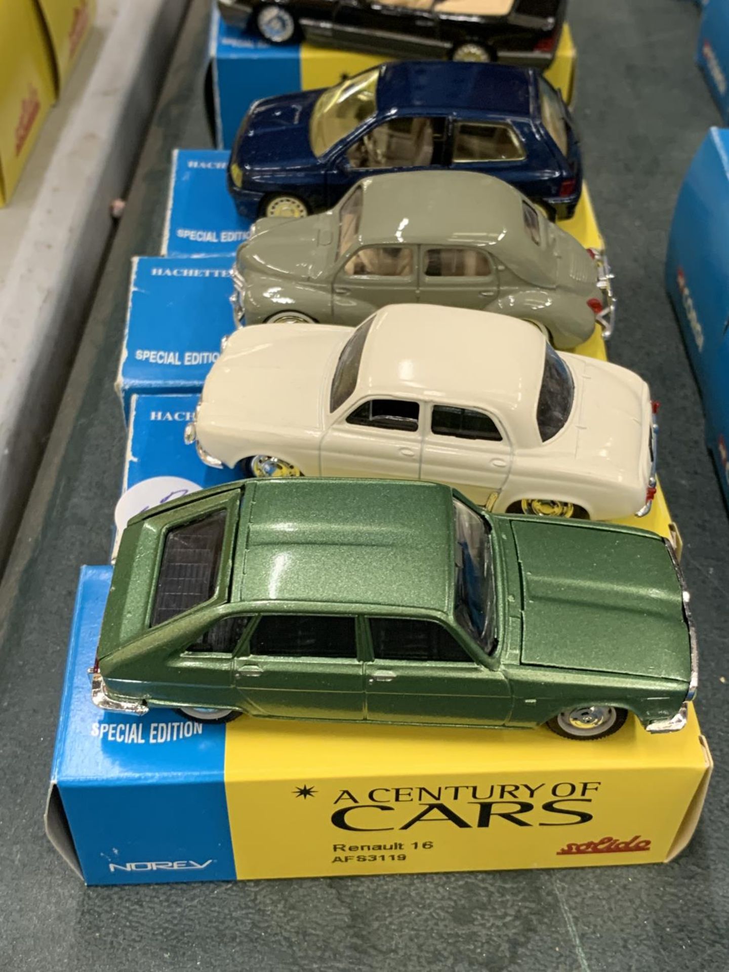 FOUR BOXED CORGI 'A CENTURY OF CARS' TO INCLUDE A RENAULT CLIO, 4 CV, 16 AND DAUPHINE