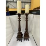 A PAIR OF LARGE GOTHIC PUGIN STYLE CANDLESTICKS, HEIGHT 62CM