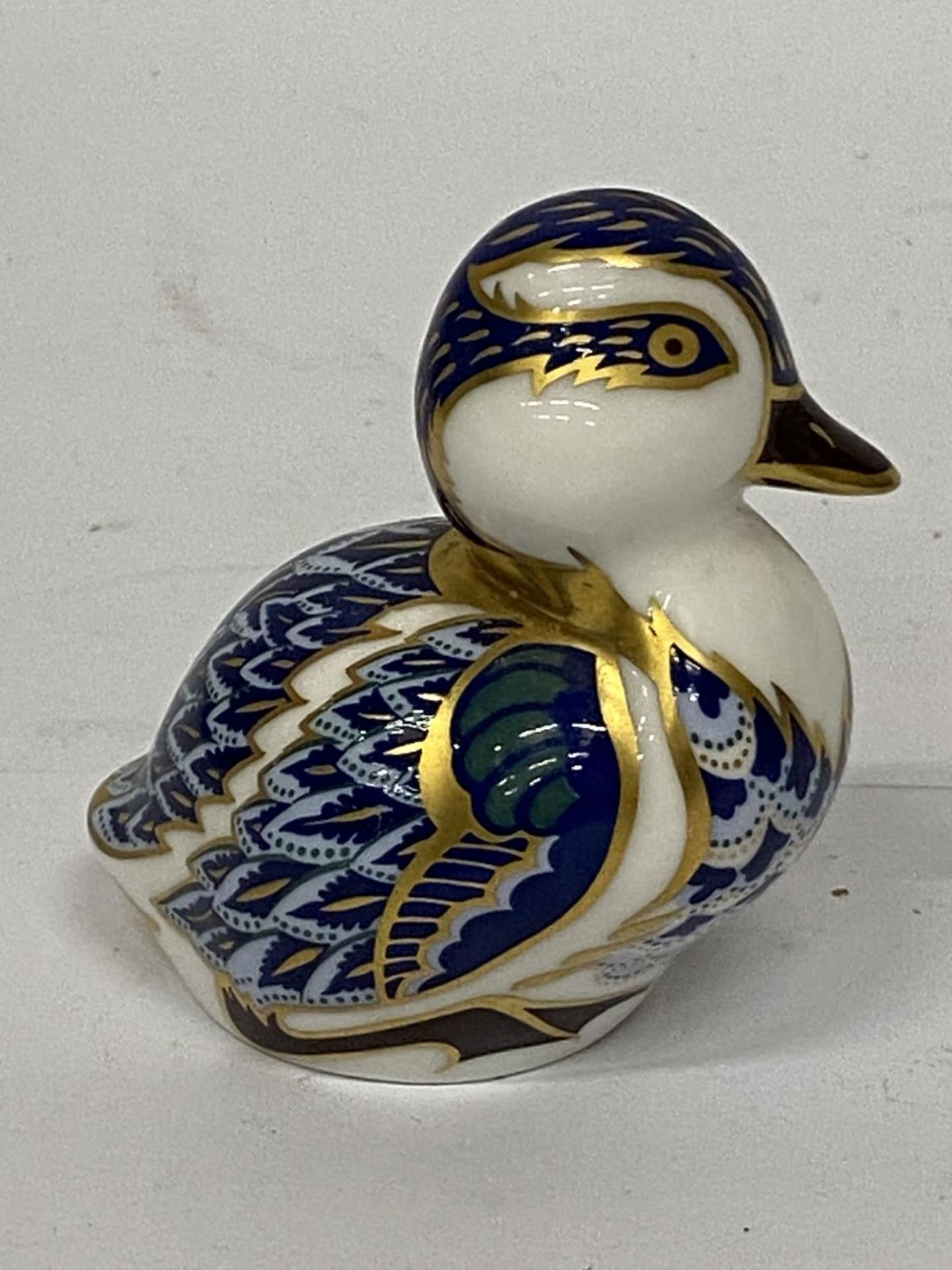 A ROYAL CROWN DERBY DUCKLING WITH GOLD STOPPER