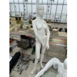 A FEMALE LIFE SIZE MANNEQUIN