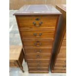 A MAHOGANY FOUR DRAWER FILING CABINET WITH INSET LEATHER TOP