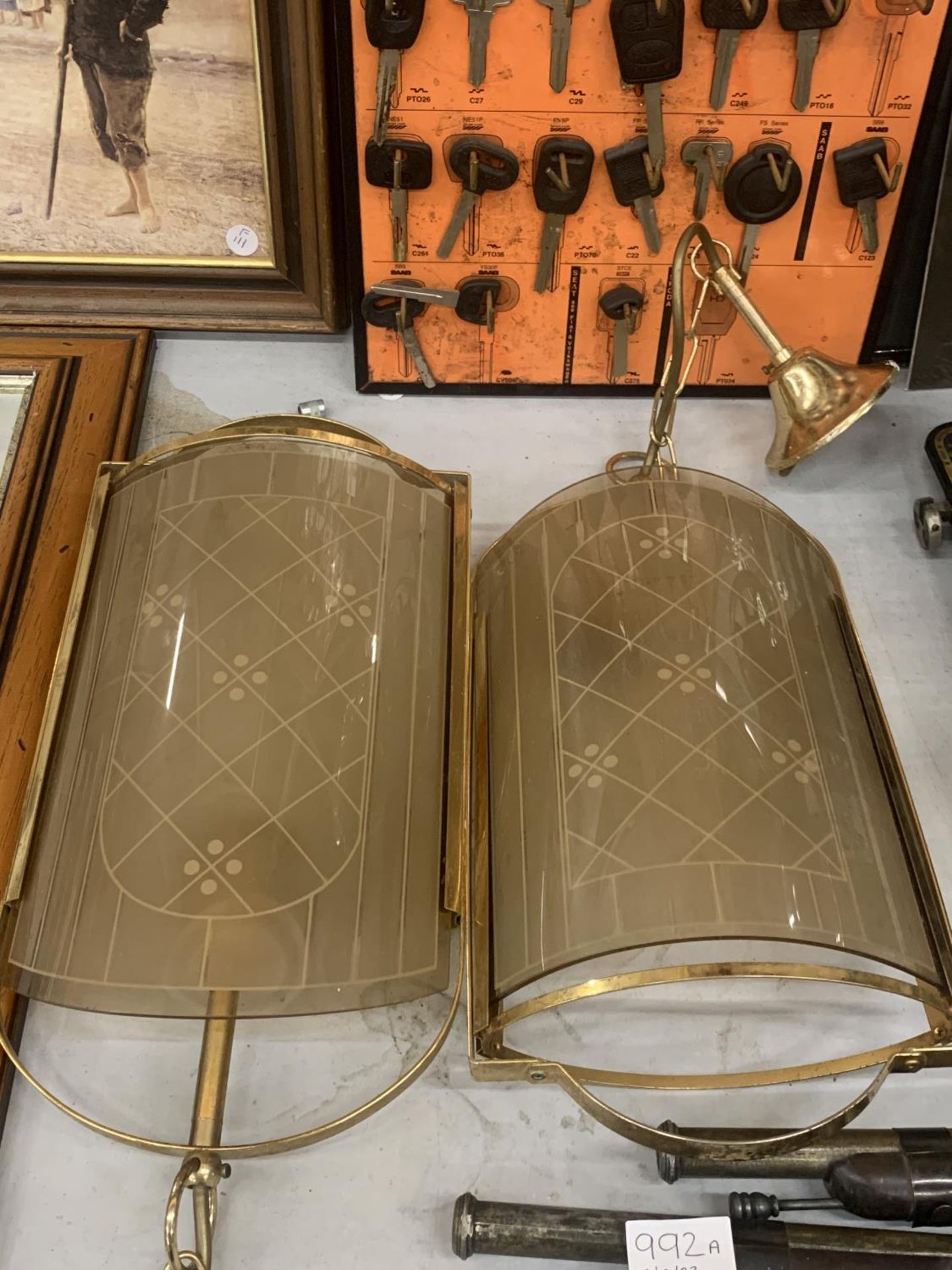 A PAIR OF VINTAGE BRASS AND GLASS WALL LAMPS