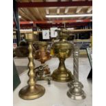A COLLECTION OF COPPER AND BRASS TO INCLUDE OIL LAMPS, CANDLESTICKS, ETC