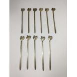 ELEVEN COCKTAIL STICKS WITH COCKEREL DESIGN TOPS (ALTHOUGH NOT MARKED THESE ARE BELIEVED TO BE