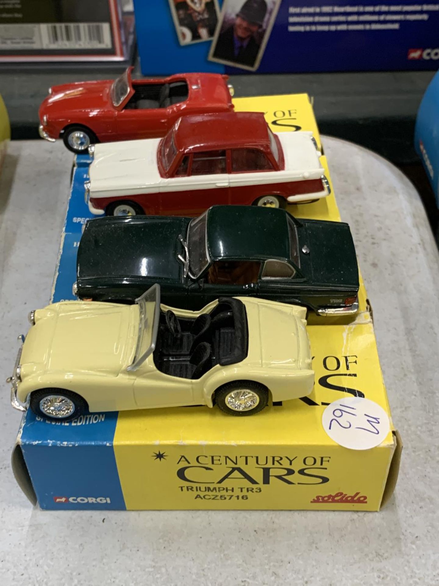 FOUR BOXED CORGI 'A CENTURY OF CARS' TO INCLUDE A TRIUMPH SPITFIRE, HERALD, TR6 AND A TR3 - Image 2 of 2