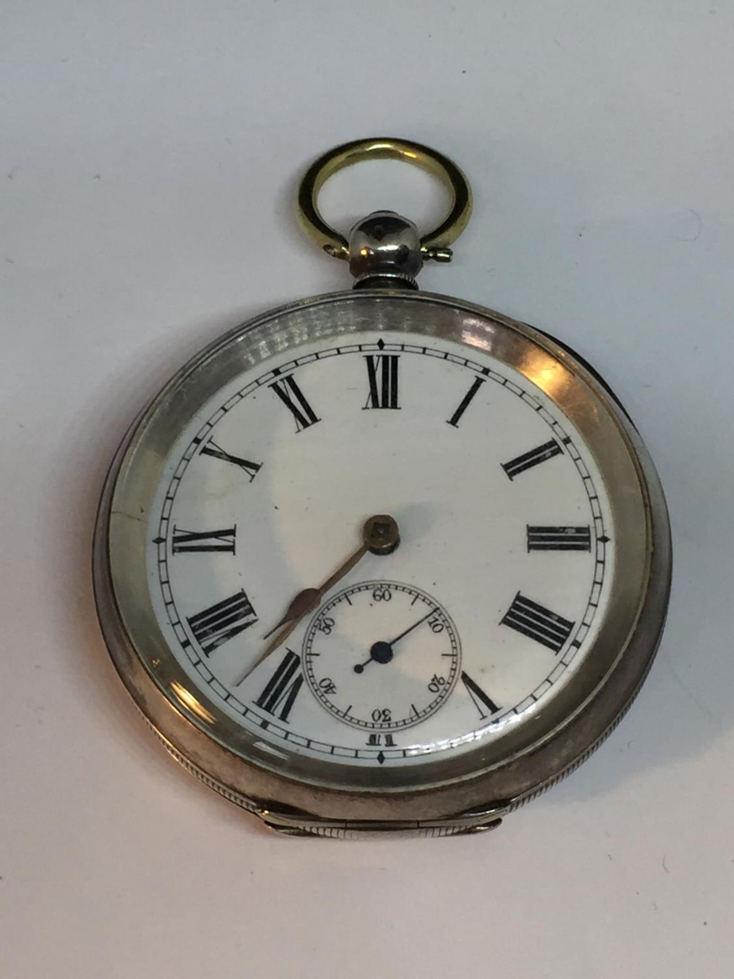 A MARKED 935 SILVER POCKET WATCH SEEN WORKING BUT NO WARRANTY GIVEN