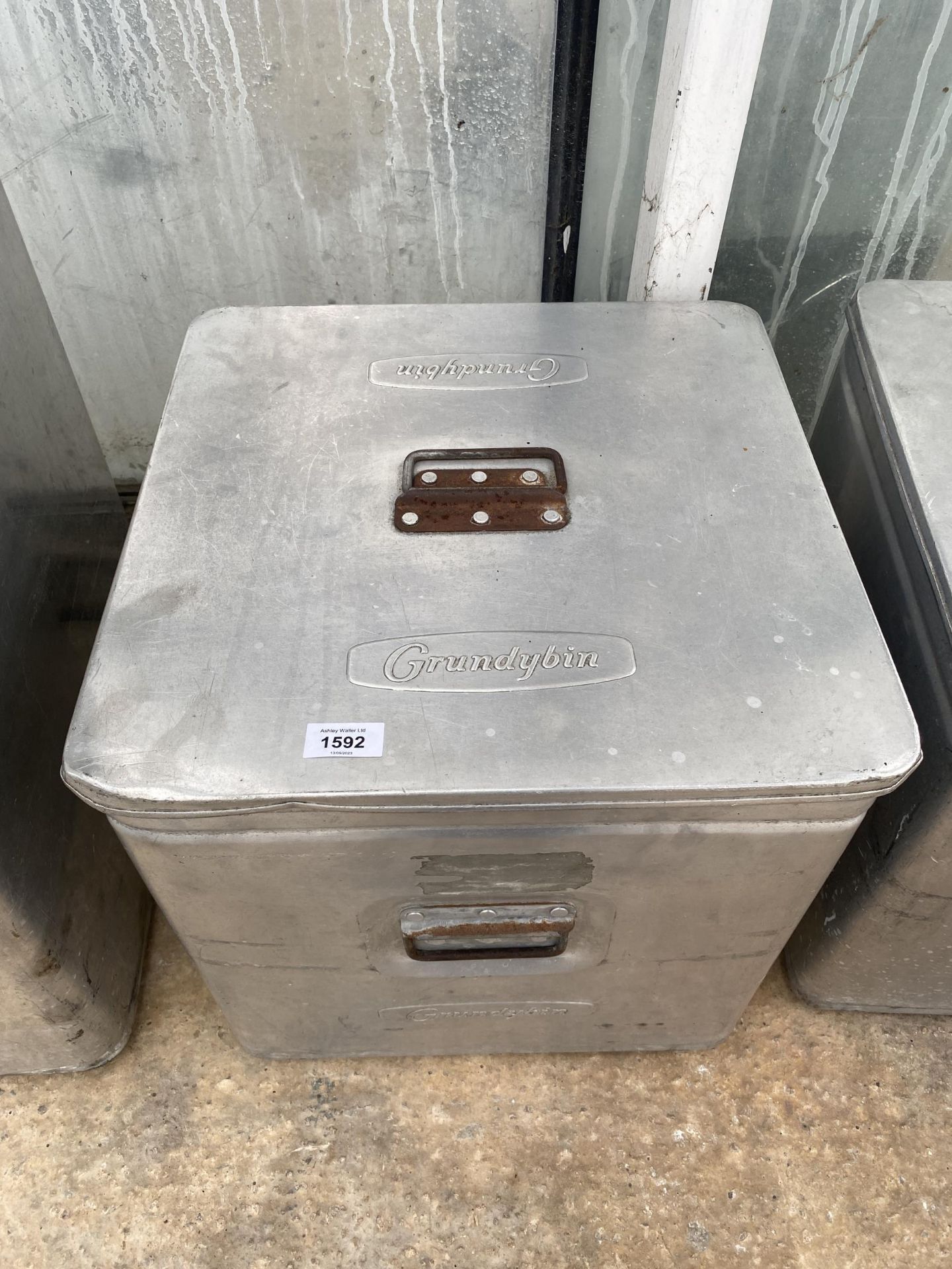 A STAINLESS STEEL GRUNDYBIN WITH LID (45CM x 42CM x 42CM)