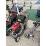 A HONDA PETROL LAWN MOWER WITH GRASS BOX (HOLES TO DECK)