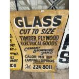 A WOODEN 'GLASS CUT TO SIZE' SIGN