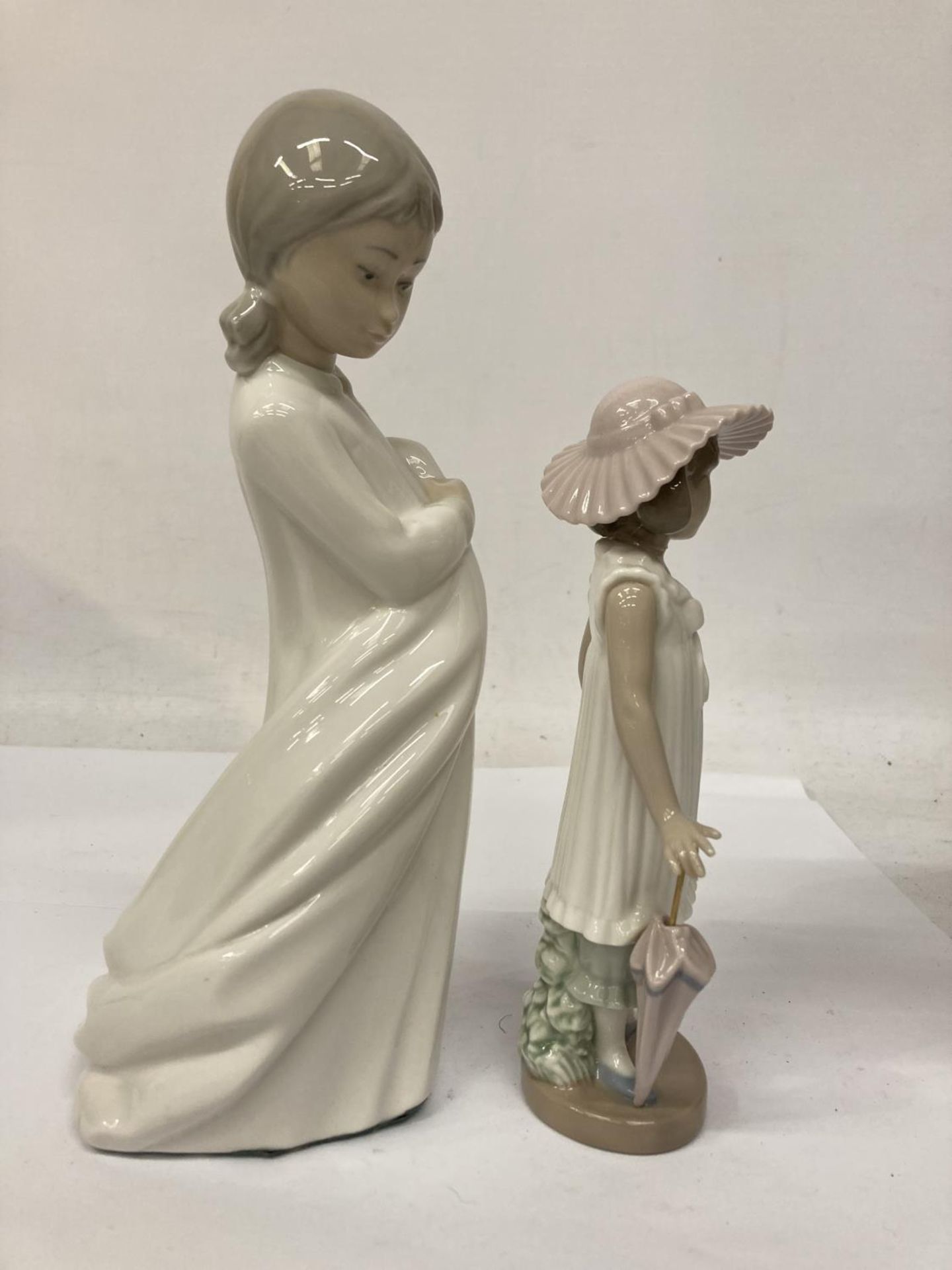 TWO NAO FIGURINES ONE HOLDING A BLANKET AND THE OTHER AN UMBRELLA - Image 3 of 7