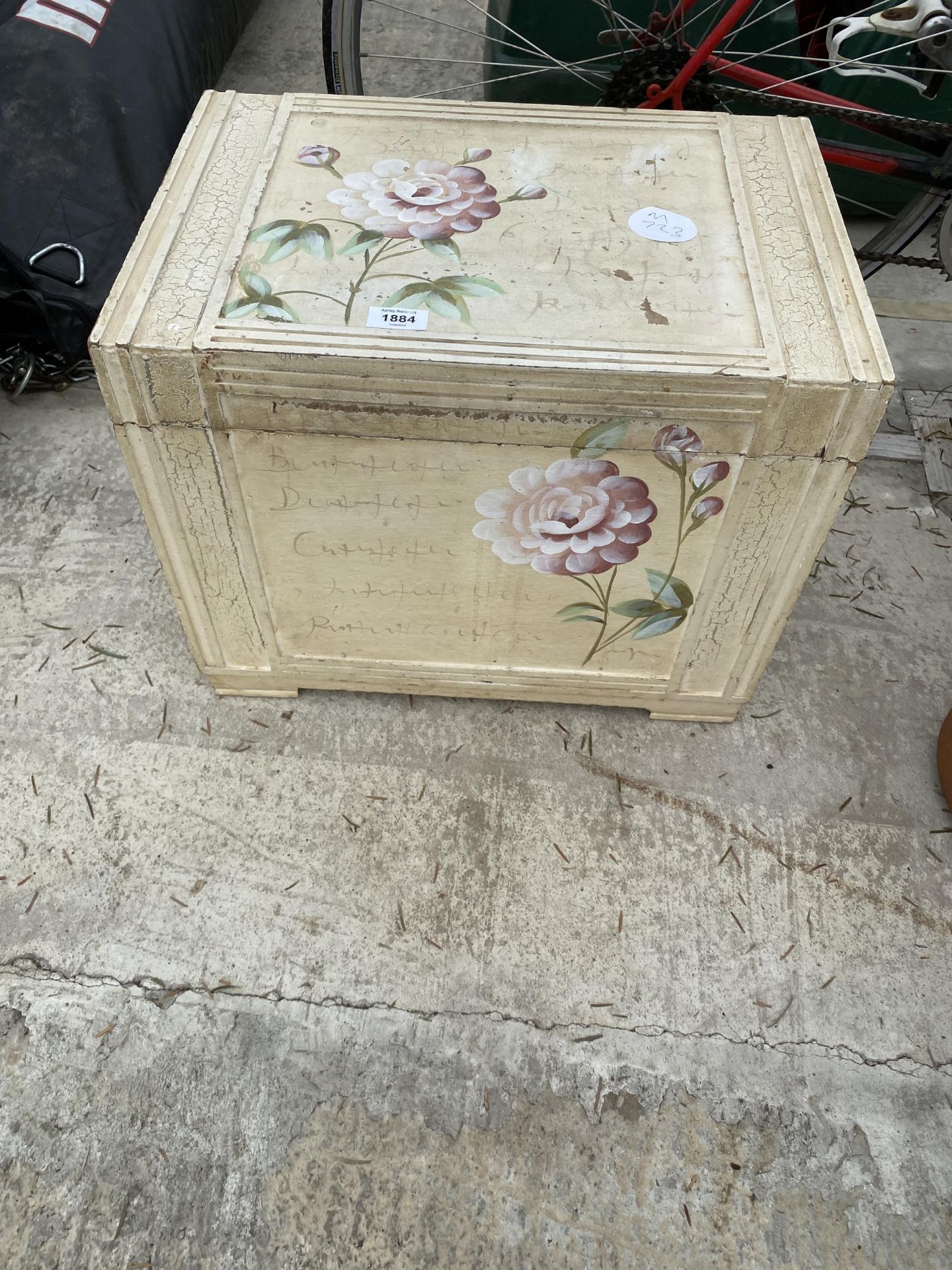 A WOODEN PAINTED LIDDED STORAGE BOX