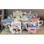 A COLLECTION OF NOVELTY CERAMIC TEAPOTS ETC