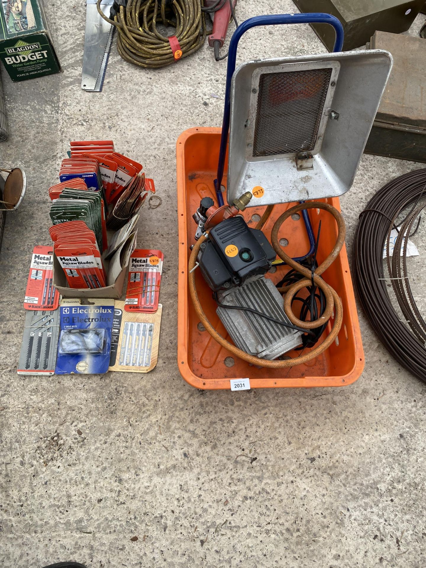 AN ASSORTMENT OF TOOLS AND HARDWARE TO INCLUDE JIGSAW BLADES, A PUMP AND A GAS HEATER ETC