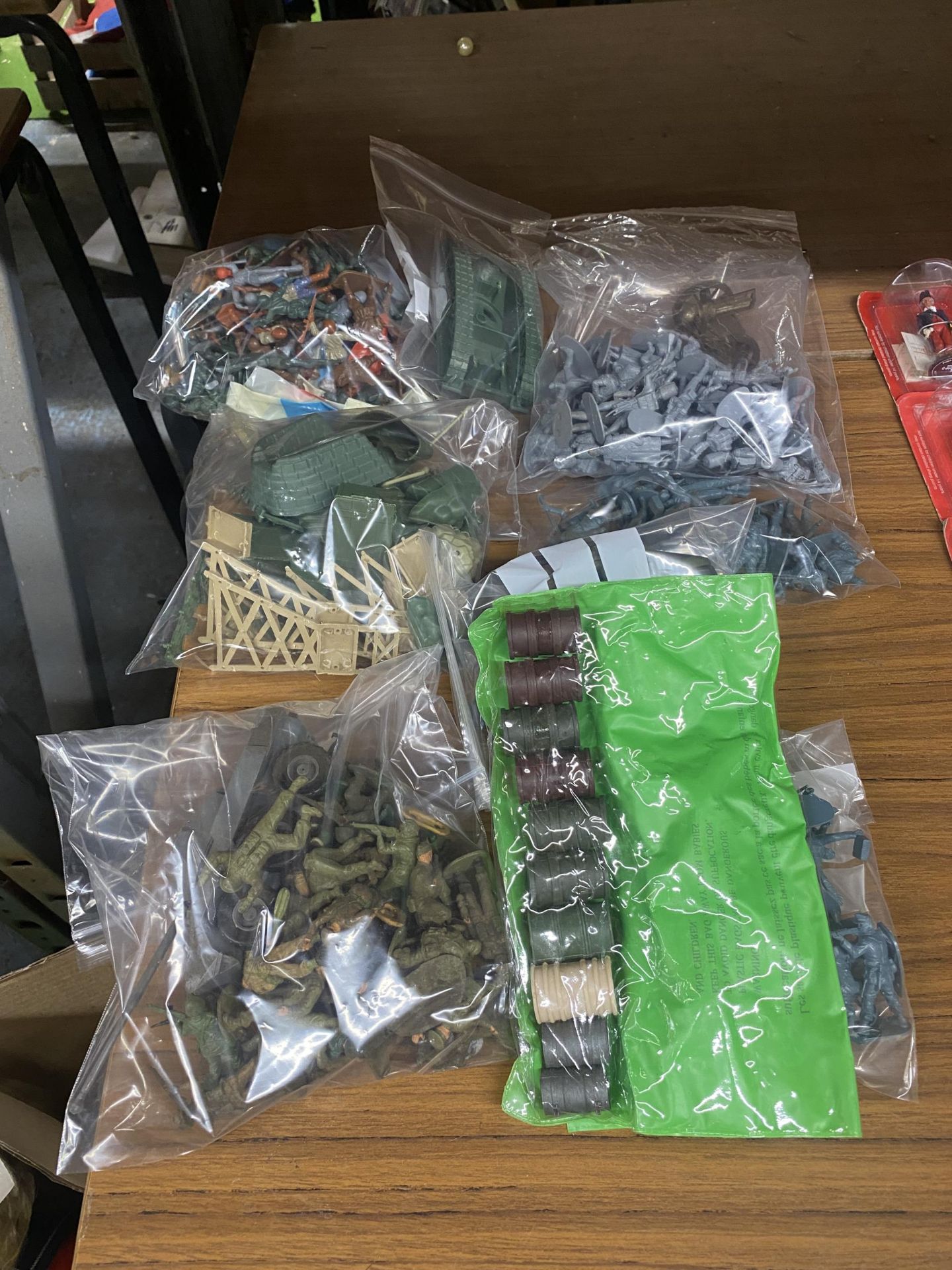 A GROUP OF ARMY FIGURES IN PLASTIC BAGS