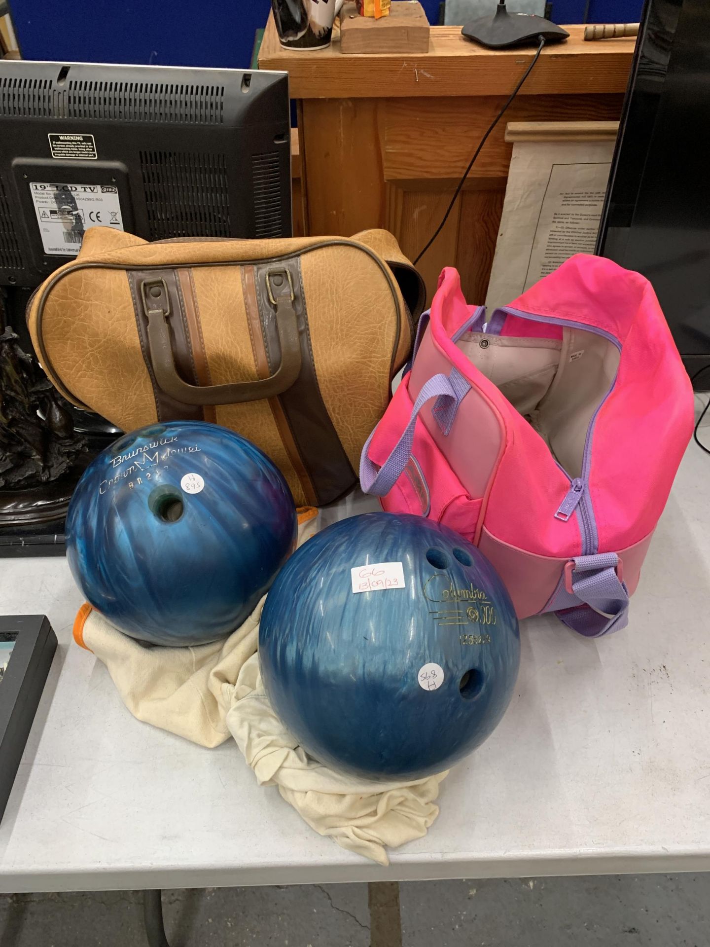 TWO TEN PIN BOWLING BALLS WITH CARRY CASES