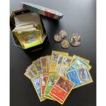 A TIN OF ASSORTED POKEMON CARDS, HOLOS, TOKENS ETC