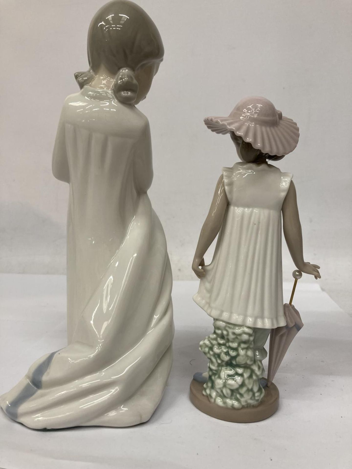 TWO NAO FIGURINES ONE HOLDING A BLANKET AND THE OTHER AN UMBRELLA - Image 5 of 7