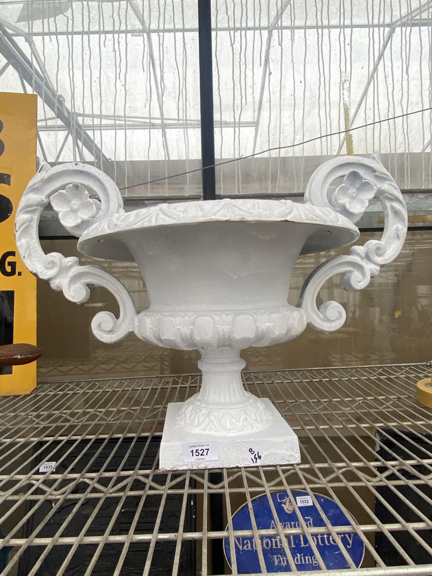 A DECORATIVE CAST IRON URN PLANTER