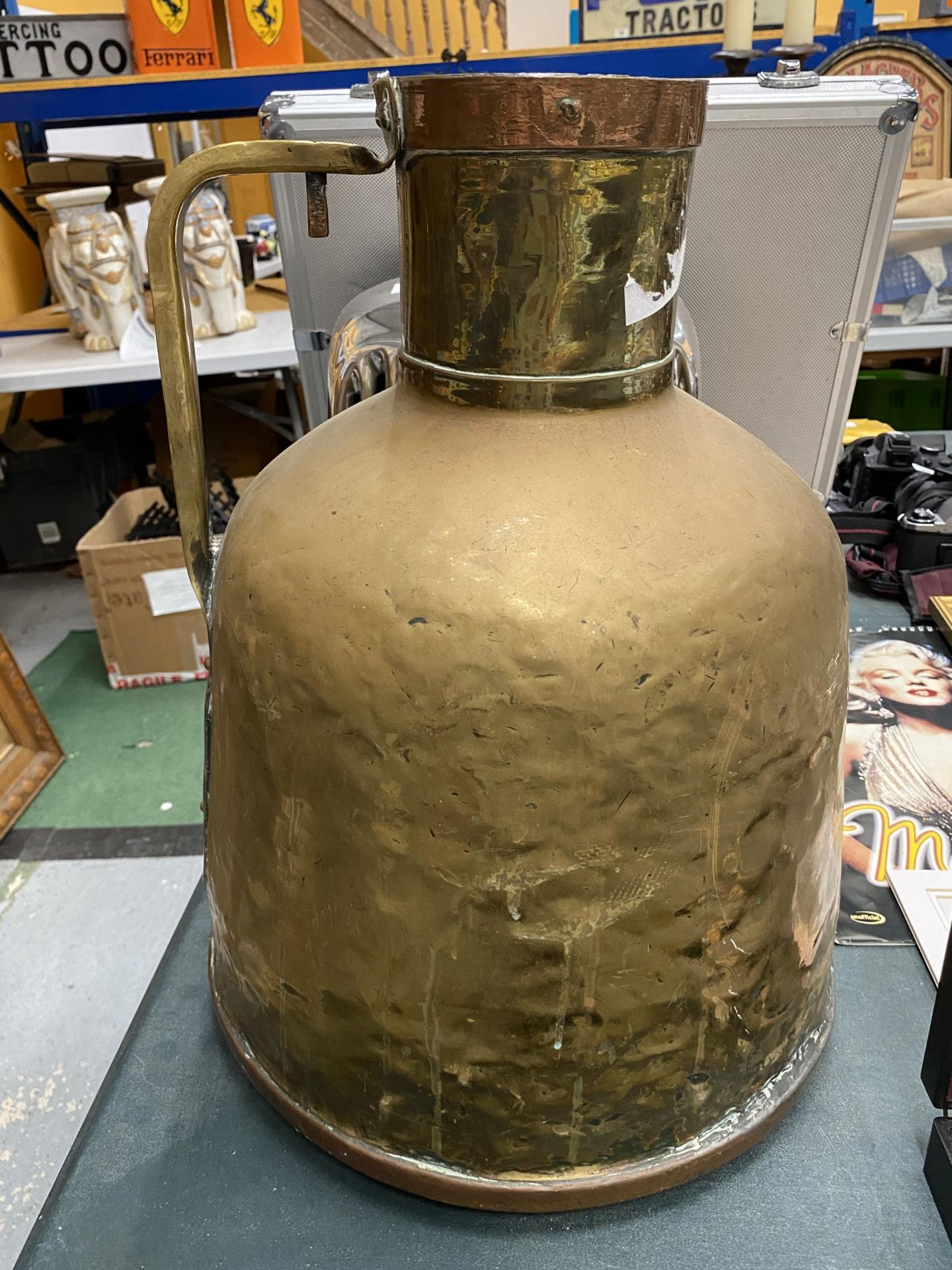 A LARGE VINTAGE BRASS VESSEL WITH COPPER BAND TOP