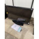 A SHARP 32" TELEVISION WITH REMOTE CONTROL