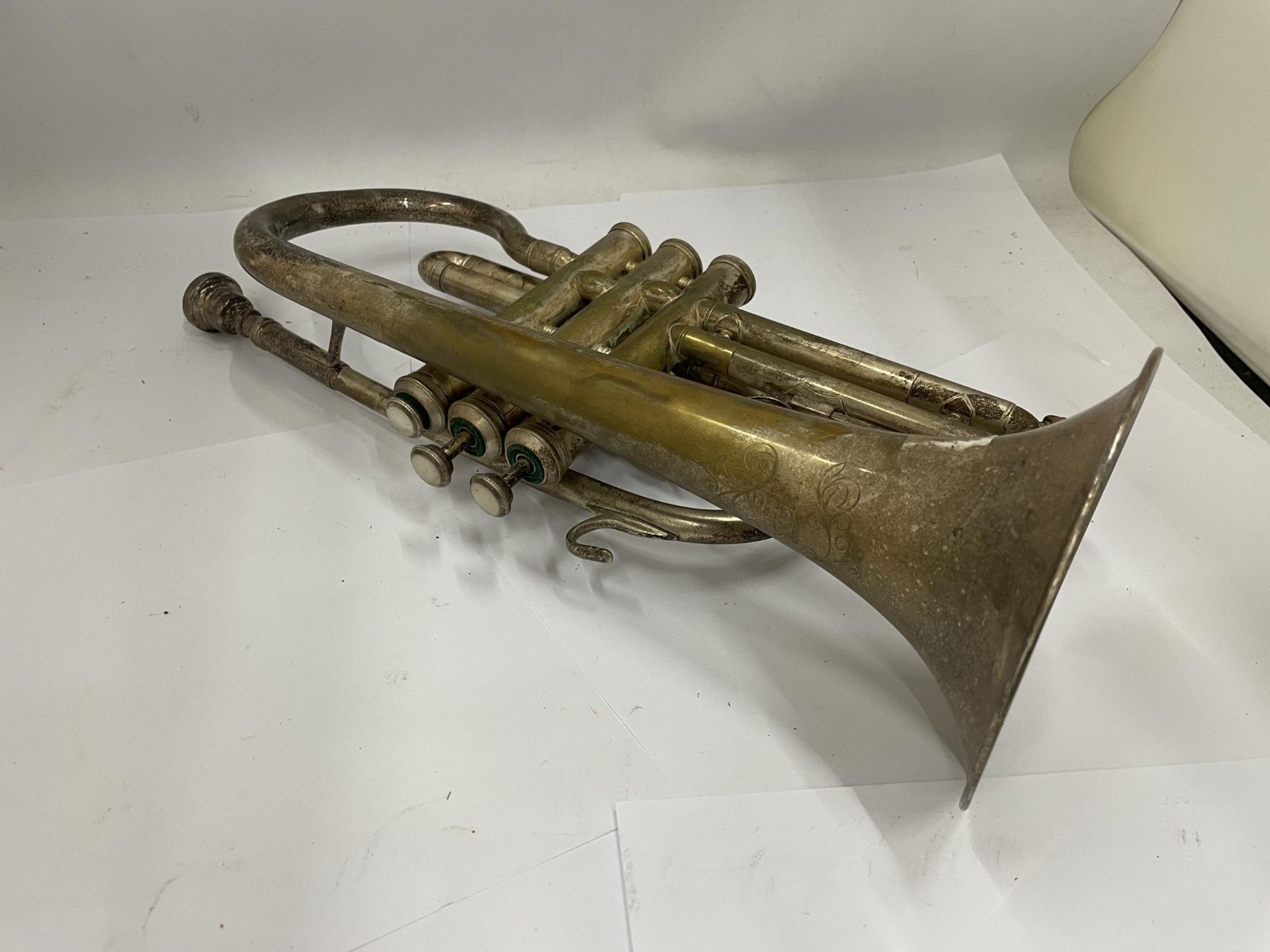 A VINTAGE BRASS CORNET