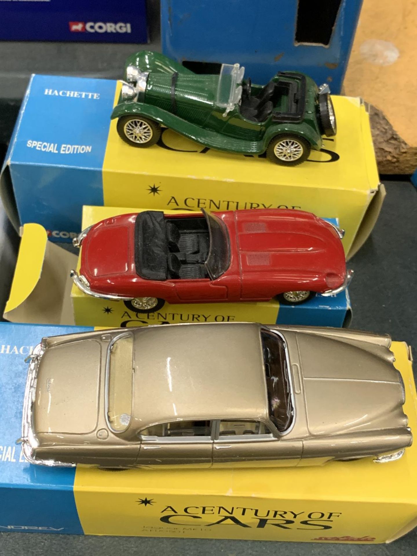 THREE BOXED CORGI 'A CENTURY OF CARS' TO INCLUDE A JAGUAR E TYPE, SS100 AND AN MK10