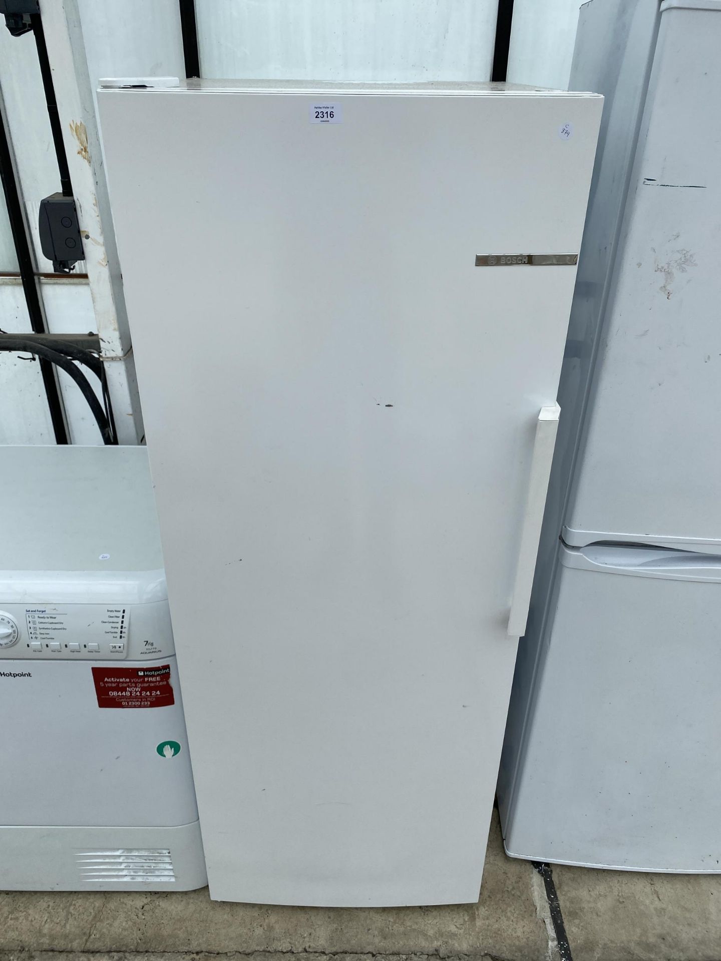 A WHITE BOSCH UPRIGHT FRIDGE