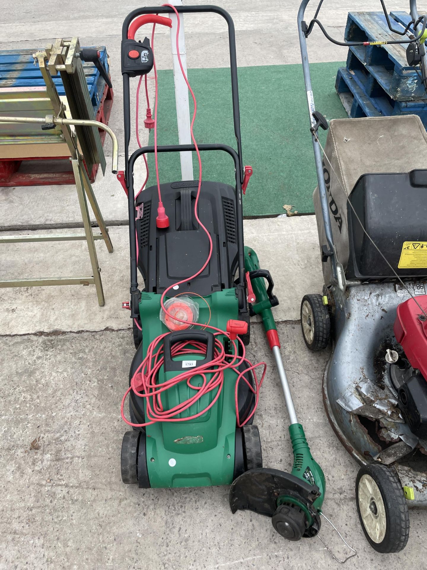 AN ELECTRIC QUALCAST LAWN MOWER AND AN ELECTRIC STRIMMER